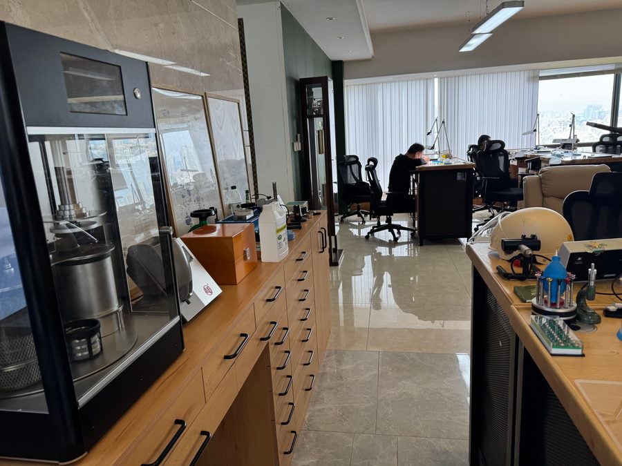 Wooden parts cabinets and a glass display case along the wall